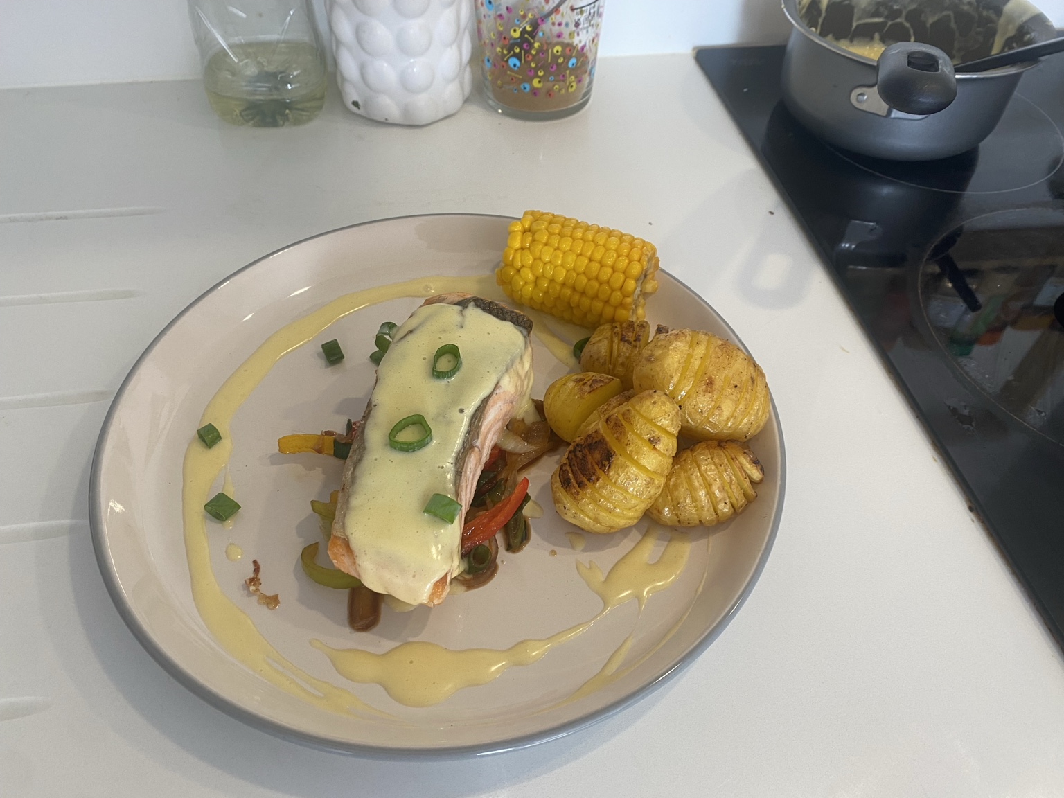 Pan-seared salmon with hollandaise and Hasselback potatoes